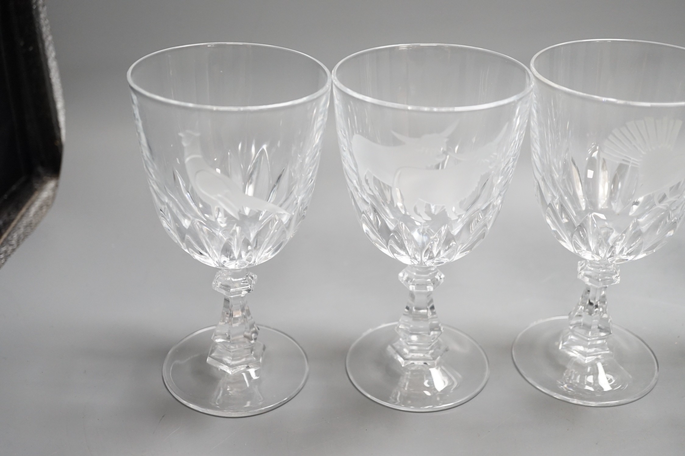 A set of six Scottish wine glasses, engraved with highland cattle and birds, 15cms high